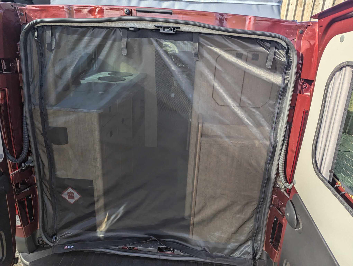 Camper van mosquito net covering rear door interior opening, black mesh with border trim