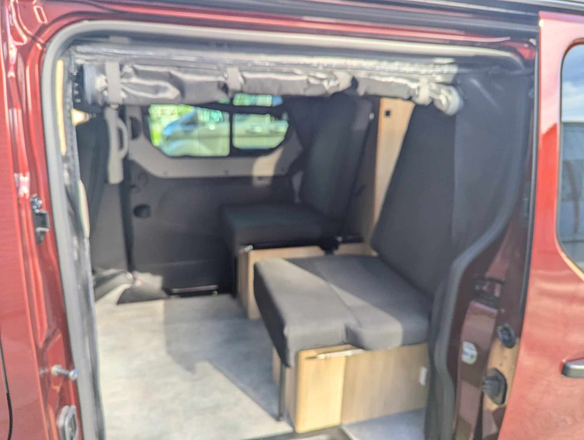 Camper van mosquito net over rear door, black mesh screen showing van interior