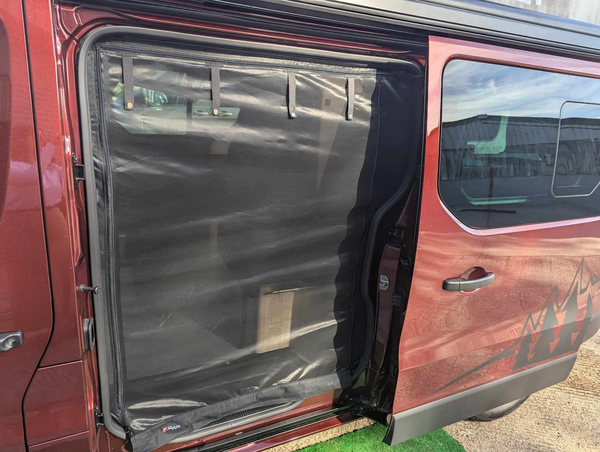 Camper van mosquito net on open side door, black mesh panel with door-frame trim