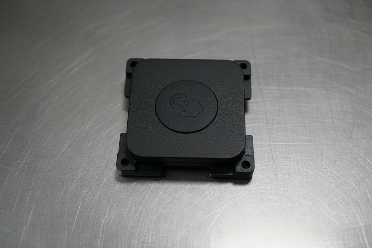 Black square control cover with power symbol on mounted base