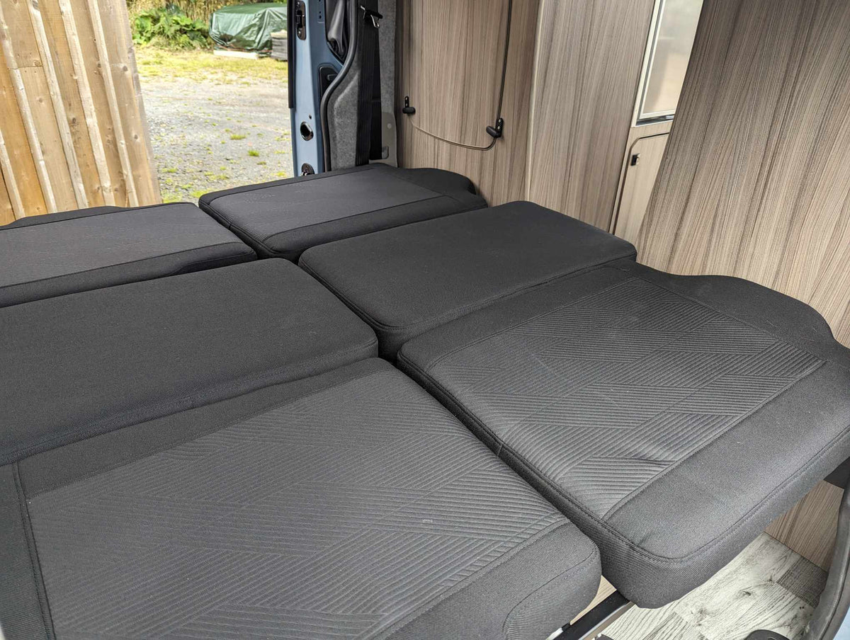 Twin-bed campervan conversion twin bed with dark grey upholstered mattress