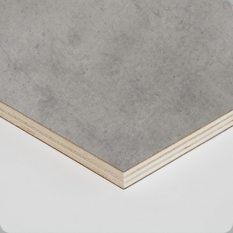 Concrete-effect worktop corner with pale layered edge trim.