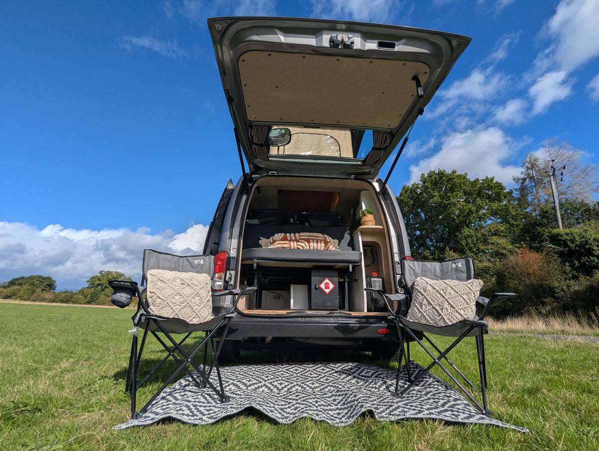 Rear door fitted windows on open hatch, showing window frame and opening