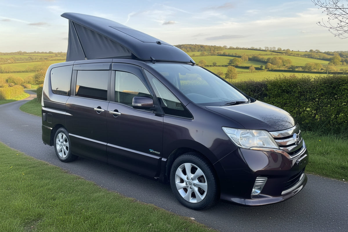 Pop-top roof for Nissan Serena camper van, raised roof canvas on black van