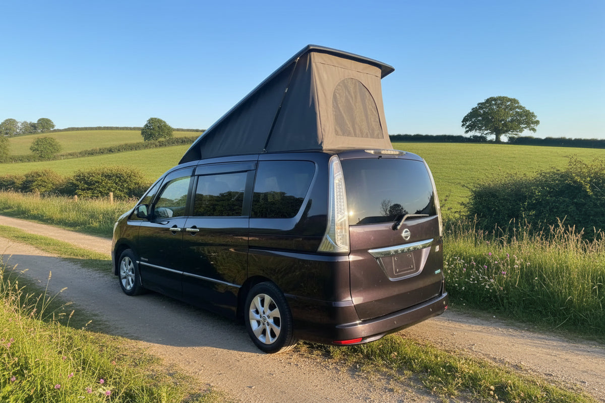 Pop-top roof for Nissan Serena camper van, raised canvas on dark van