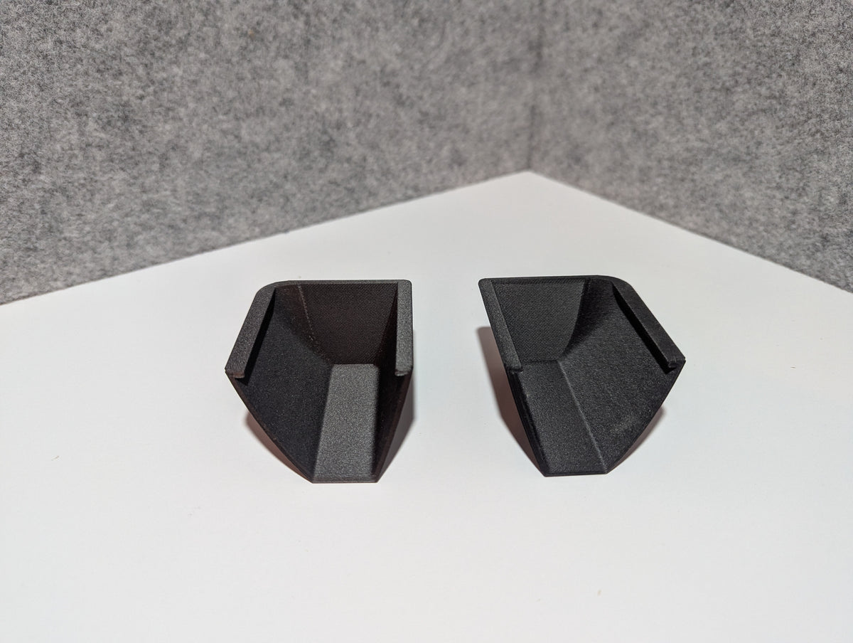 Pair of black roof rack replacement end caps with hollow interior