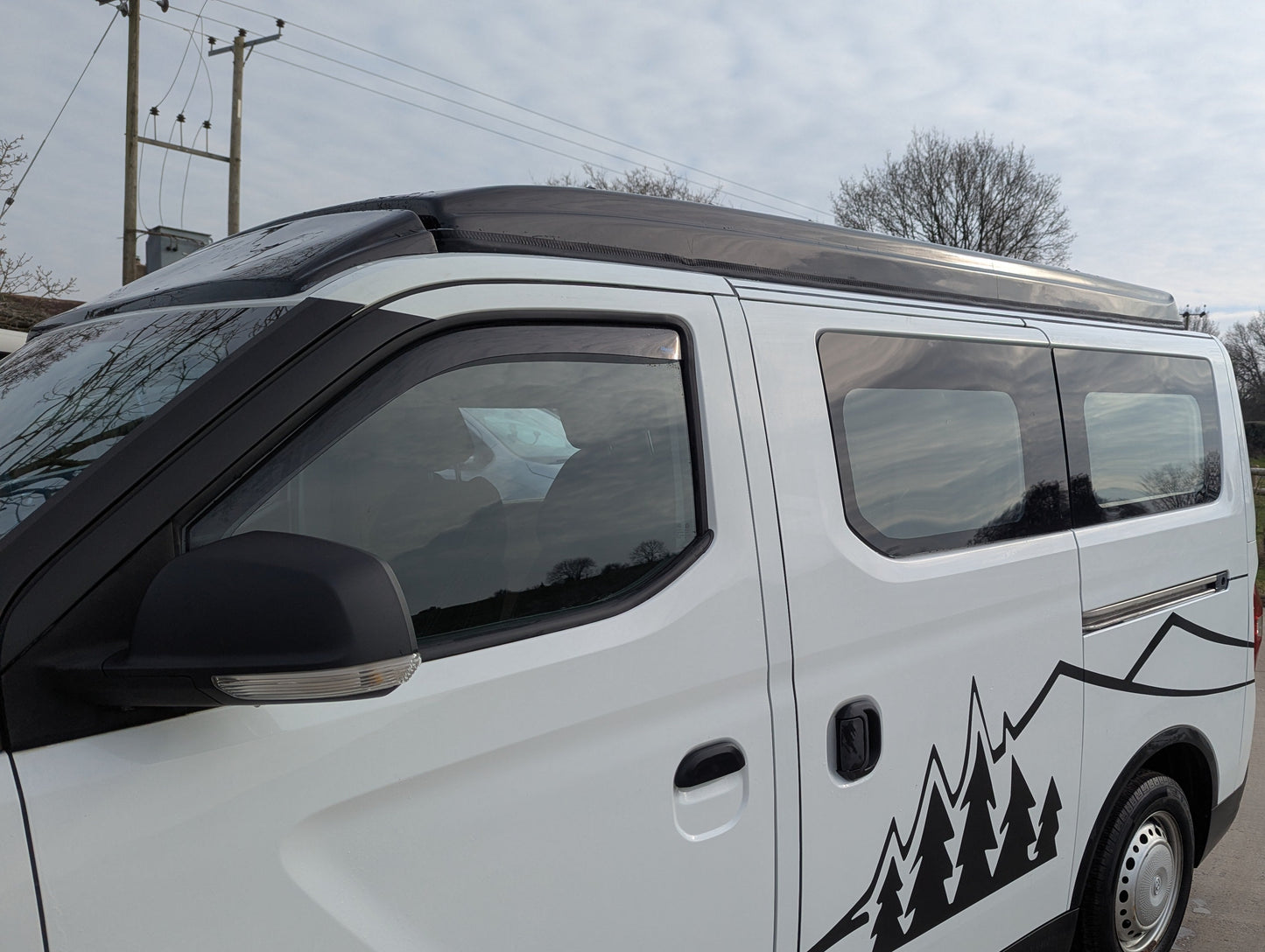 Upgrade your SAIC Maxus eDeliver 3 campervan with the Stargaze Rear Elevating Roof and optional window installation. Enhance headroom, ventilation, and natural light for a more comfortable and spacious adventure. Professionally fitted with high-quality materials.