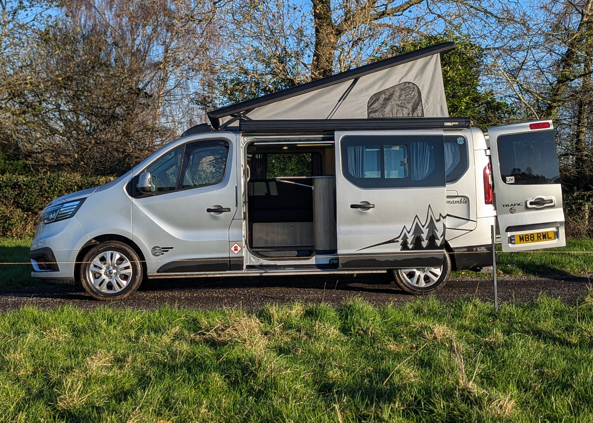 Renault campervan exterior with side door open and integrated awning
