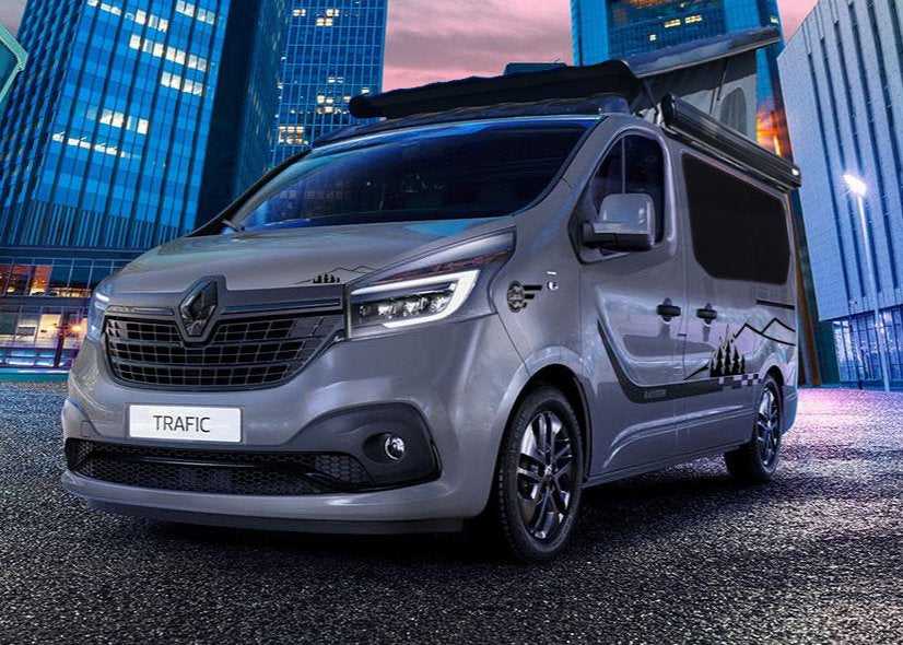 Gray campervan conversion with elevated pop-top roof and side windows