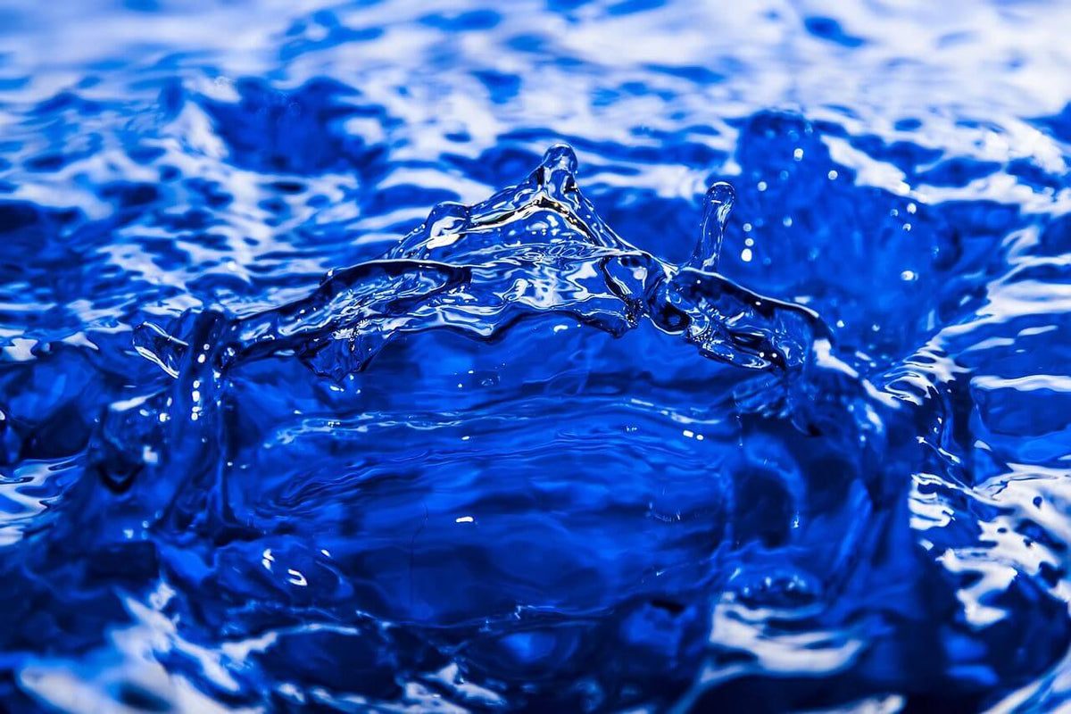 Blue water-like coolant fluid splash