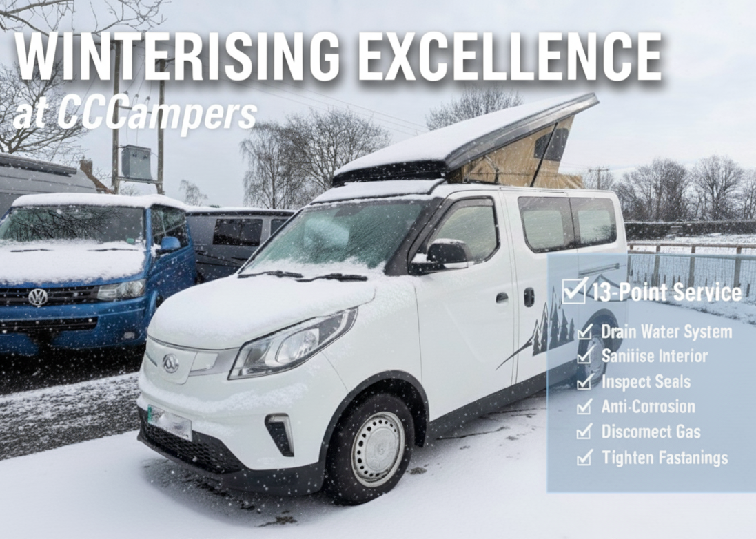 Campervan winterising service with white campervan in snowy conditions, front view