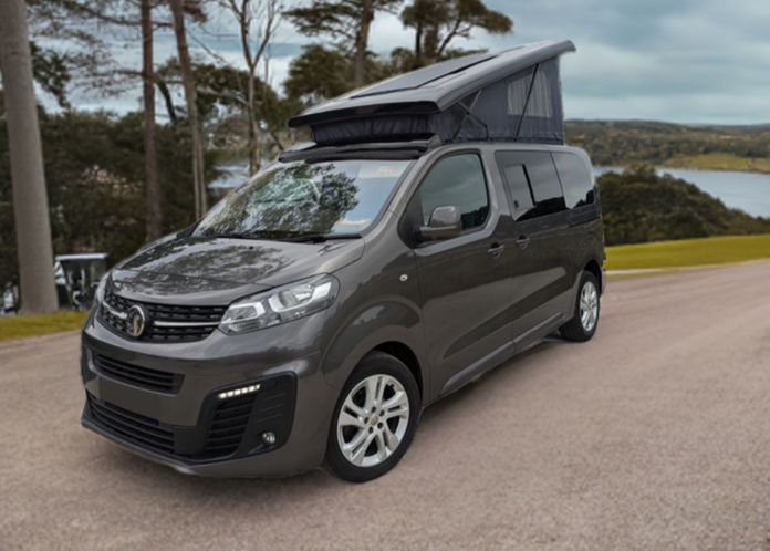 Dark gray campervan conversion van with pop-top roof raised, front three-quarter view