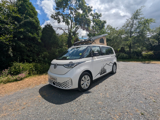 Volkswagen ID Buzz electric campervan with pop-top roof extended, showcasing a premium electric campervan conversion by CC Campers