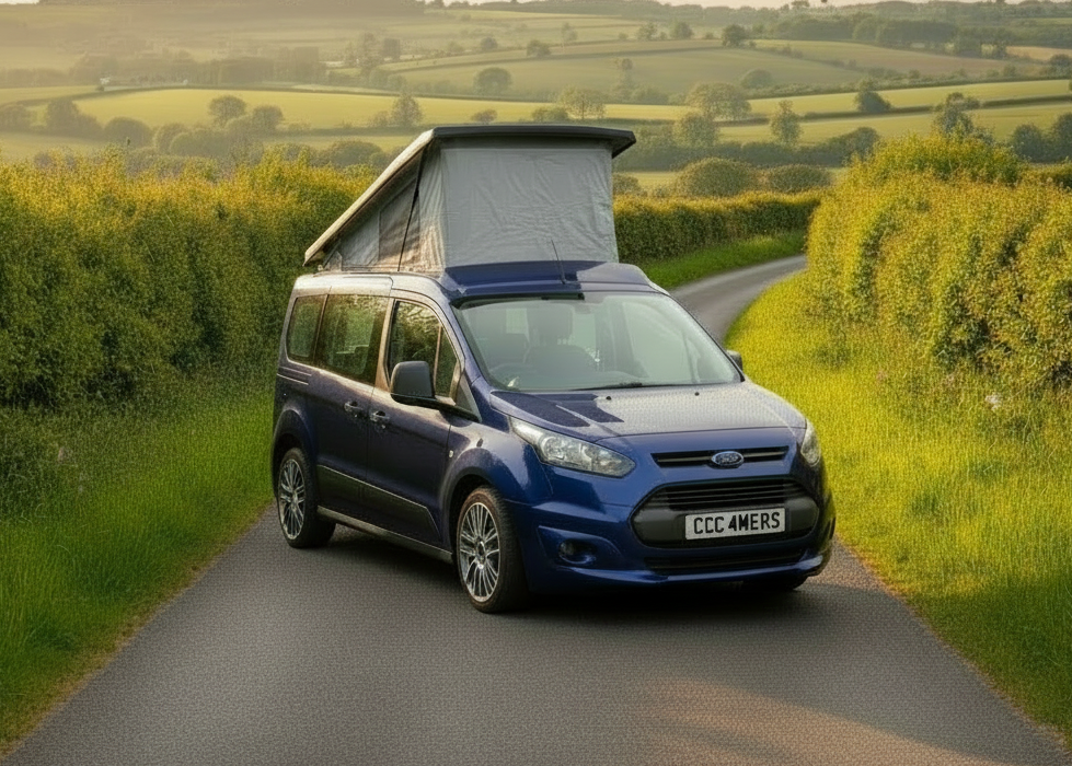 Blue FORD TRANIST CONNECT camper van with an open roof on a country road