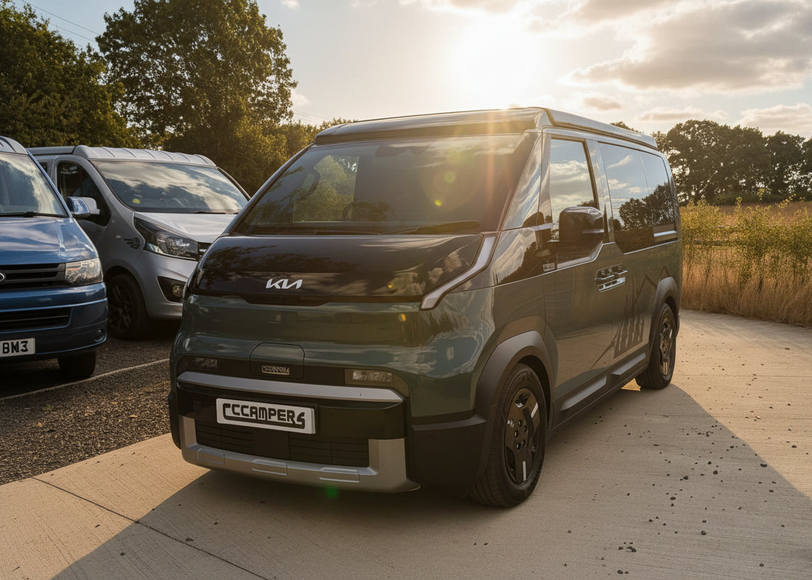 Olive Kia van with pop-top roof raised, front three-quarter view