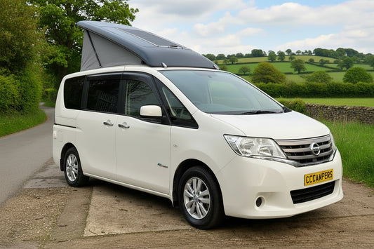 Pop-top roof for Nissan Serena camper van, roof closed on white van