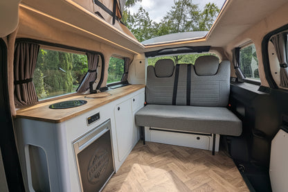 White and oak Interior detail of The Wyre VW ID. Buzz electric campervan by CCCAMPERS, showcasing premium British-built fit and finish.
