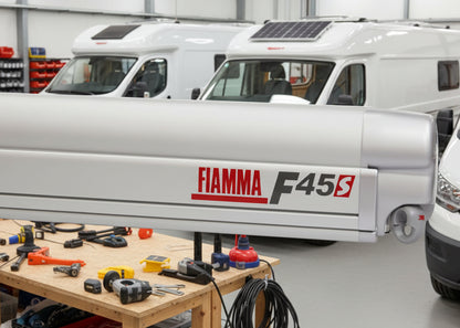 Fiamma F45S wall-mounted box awning in Titanium case with Royal Grey canopy, professionally fitted by CCCampers